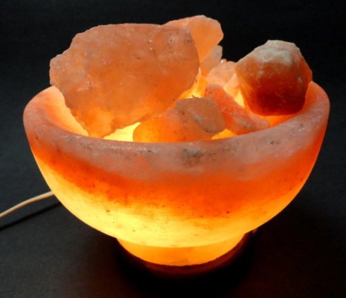 Salt lamp in the shape of a bowl with several small salt rocks resembling that of a water fountain