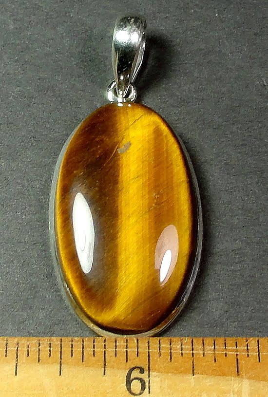 Sterling Silver pendant with a 20mm x 35mm Tiger Eye cabochon