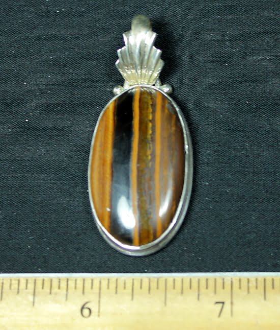 sterling Silver pendant with a 1/2" by 1 1/4" Tiger Eye stone