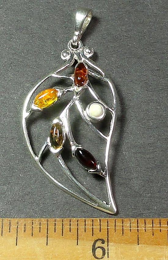 Silver Amber pendant with several small multi-colored Amber stones