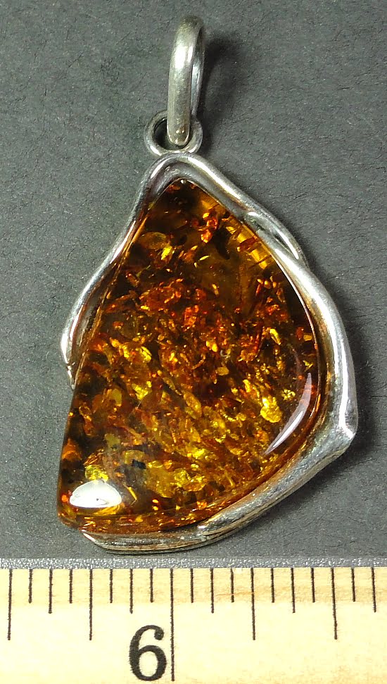 sterling silver setting with a 20mm x 32mm Amber cabochon