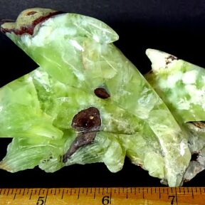 Dolphins carved from a Prehnite matrix
